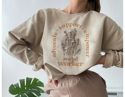 Oibrí Sóisialta Léine Bláthanna Fiáine, Mí na hOibre Sóisialta, Tacaíocht Abhcóide Empower, Céimeanna Mac Léinn, Oibrí Sóisialta Scoile, sweatshirt Unisex