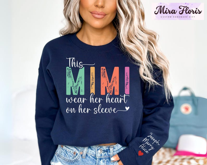This Mimi Wear Her Heart On Her Sleeve Mimi Sweatshirt, Custom Mimi Sweatshirt With Kids Name, Nana Gift Hoodie, Kids Name on Sleeve
