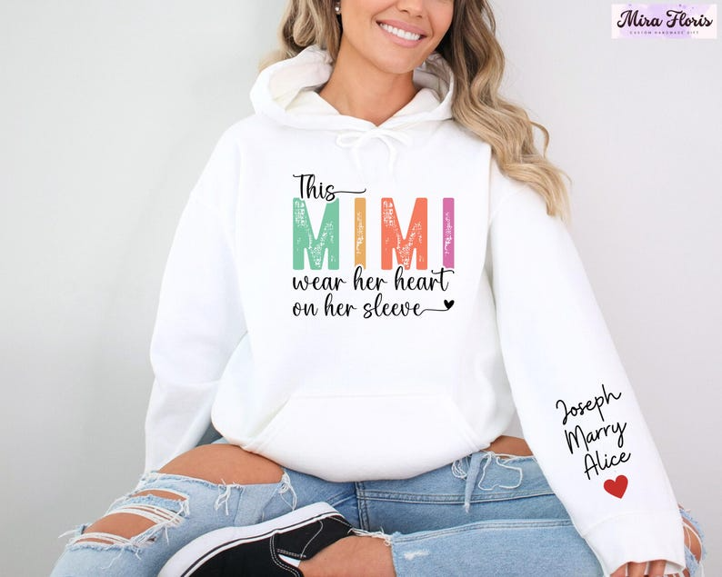 This Mimi Wear Her Heart On Her Sleeve Mimi Sweatshirt, Custom Mimi Sweatshirt With Kids Name, Nana Gift Hoodie, Kids Name on Sleeve