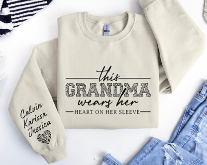 Custom Grandma Sweatshirt, This Grandma Wears Her Heart On Her Sleeve Sweater, With Kids Name On Sleeve, Grandma Sweater,Custom Grandma Gift