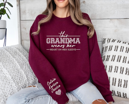 Custom Grandma Sweatshirt, This Grandma Wears Her Heart On Her Sleeve Sweater, With Kids Name On Sleeve, Grandma Sweater,Custom Grandma Gift