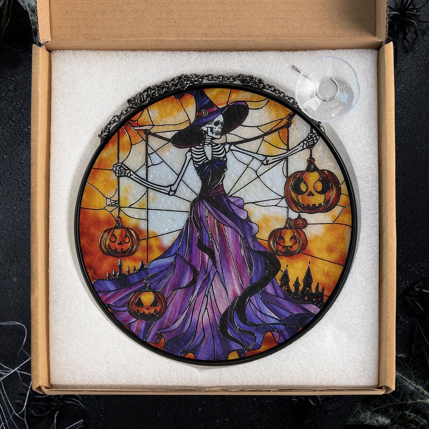 Gothic Halloween Stained Glass Suncatcher – Skeleton Witch in Purple Dress Holding Jack-o'-Lanterns with Spider Web and Haunted Castle