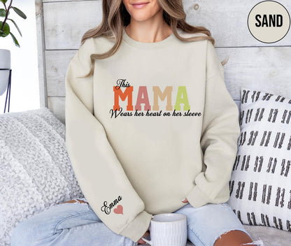 Custom This Mama Wears Her Heart On Her Sleeve Hoodie, Personalized Mom Sweatshirt With Kids Names, Cute Momma Outfit, Mothers Day Gifts